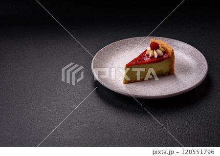 Delicious sweet dessert cheesecake with raspberry and pistachio flavor 120551796