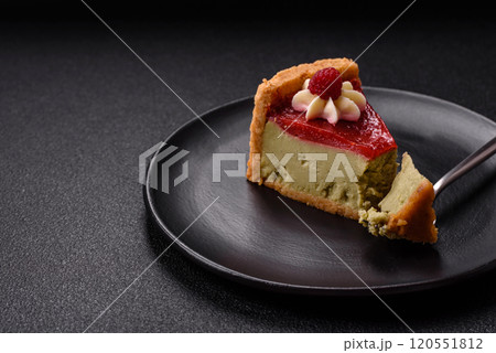 Delicious sweet dessert cheesecake with raspberry and pistachio flavor Delicious sweet dessert cheesecake with raspberry and pistachio flavor 120551812