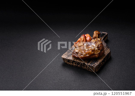 Duck leg baked with apples and sauce 120551967