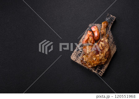 Duck leg baked with apples and sauce 120551968