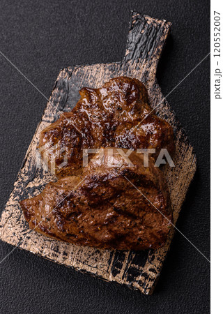 Juicy beef steak grilled with salt, spices and herbs 120552007