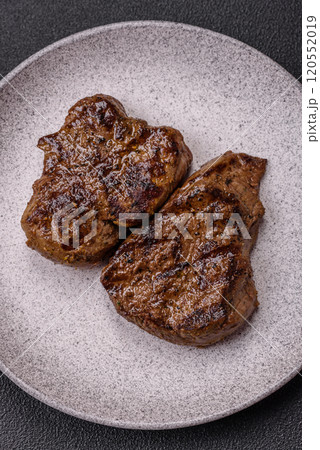 Juicy beef steak grilled with salt, spices and herbs 120552019