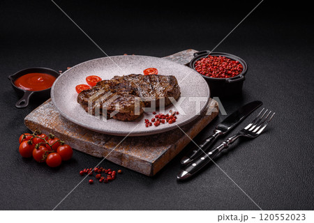 Juicy beef steak grilled with salt, spices and herbs Juicy beef steak grilled with salt, spices and herbs 120552023