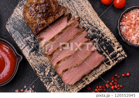 Juicy beef steak grilled with salt, spices and herbs 120552045