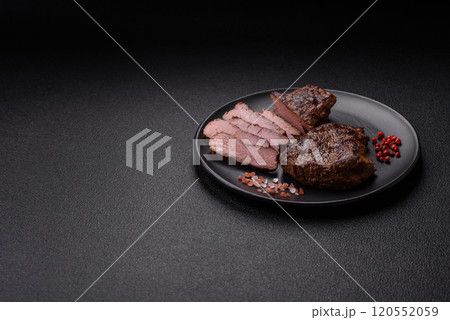 Juicy beef steak grilled with salt, spices and herbs Juicy beef steak grilled with salt, spices and herbs 120552059