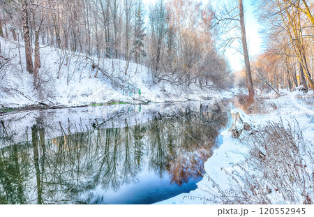 Fantastic landscape in city park with snowy trees and beautiful frozen river. Fantastic landscape in city park with snowy trees and beautiful frozen river. 120552945