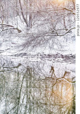 Fabulous landscape in city park with snowy trees and beautiful frozen river. Fabulous landscape in city park with snowy trees and beautiful frozen river. 120552977