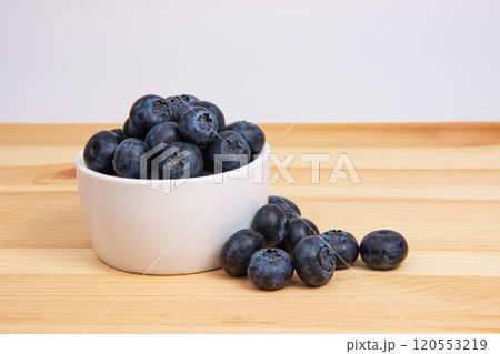 Fresh blueberry in white dish on wooden background copyspace Fresh blueberry in white dish on wooden background copyspace 120553219