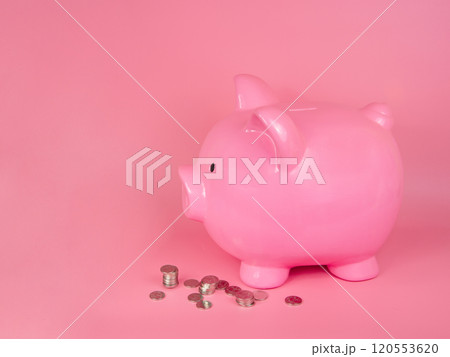 Pink piggy bank ceramic money coins toy on pink background Pink piggy bank ceramic money coins toy on pink background 120553620
