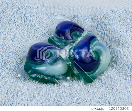 Colorful gel capsule for washing on blue material soft background Colorful gel capsule for washing on blue material soft background 120553808