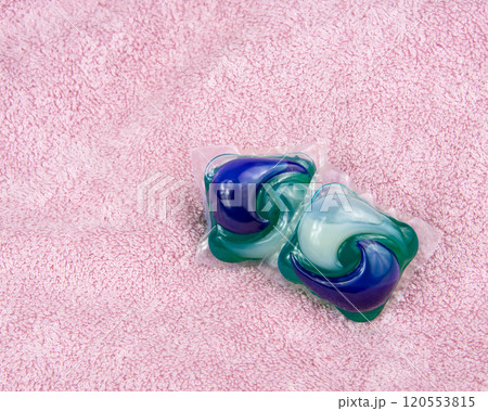 Colorful gel capsule for washing on pink material soft background Colorful gel capsule for washing on pink material soft background 120553815