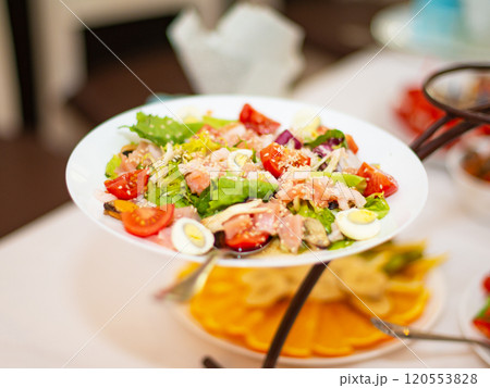 Tasty seafood salad with vegetables mix on table Tasty seafood salad with vegetables mix on table 120553828