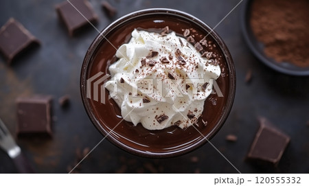 Indulgent dark chocolate dessert with creamy whipped topping 120555332