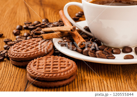 Coffee beans and a cup of coffee.cup of coffee and beans on dark background, top view 120555844