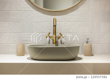 Elegant Modern Bathroom Sink Featuring Stylish Brass Fixtures for a Contemporary Look Elegant Modern Bathroom Sink Featuring Stylish Brass Fixtures for a Contemporary Look 120557382