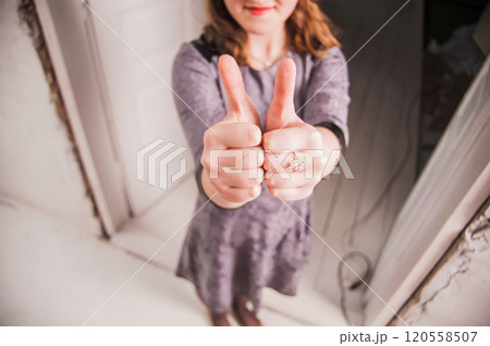 Hands of young people in the indoor, team concept.girls pointing their fingers up the hill showing ok Hands of young people in the indoor, team concept.girls pointing their fingers up the hill showing ok 120558507