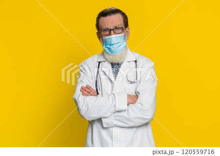 Happy Senior doctor man removing, taking off medical protective mask, ending of flu pandemic Happy Senior doctor man removing, taking off medical protective mask, ending of flu pandemic 120559716