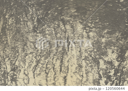 ライトベージュとグレーアッシュカラーの風化したざらざらの砂岩風テクスチャー 120560644