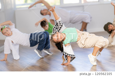Tween girl dancer rehearsing krump dance at group workout Tween girl dancer rehearsing krump dance at group workout 120562105