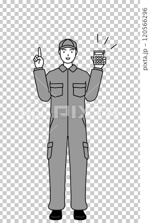 A mechanic in overalls holding a calculator and pointing 120566296