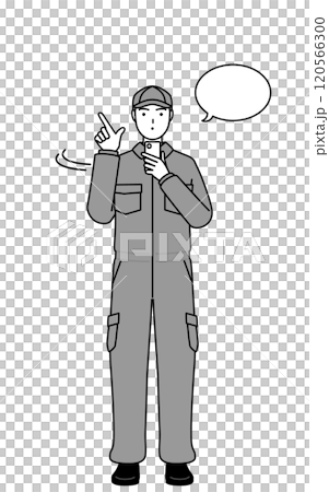A mechanic in overalls operating a smartphone A mechanic in overalls operating a smartphone 120566300