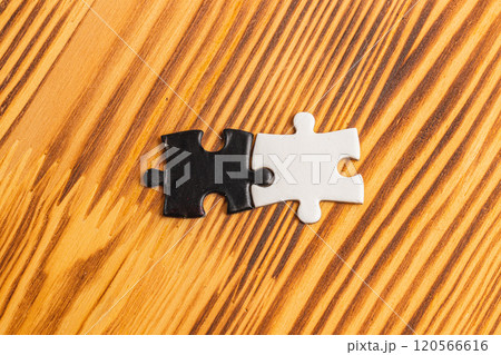 A black and white puzzle piece fit for a concept of yin yang or opposites 120566616
