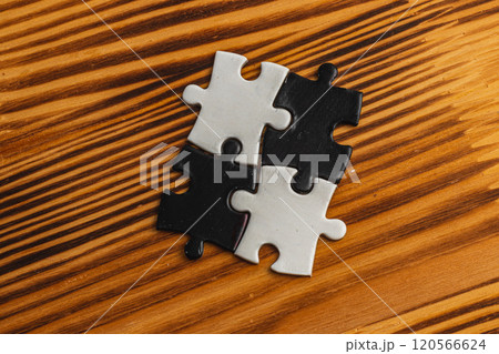 A black and white puzzle piece fit for a concept of yin yang or opposites A black and white puzzle piece fit for a concept of yin yang or opposites 120566624