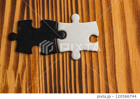 A black and white puzzle piece fit for a concept of yin yang or opposites 120566744