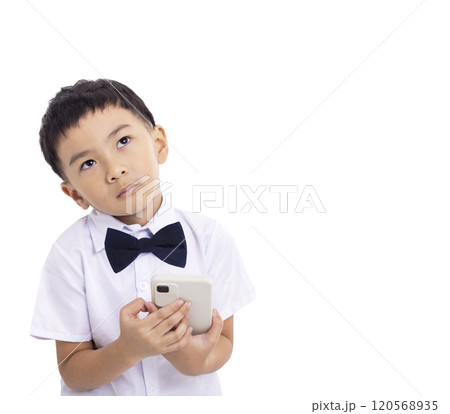 Thinking dreaming and confuse kid  using mobile phone 120568935