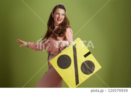 happy modern woman in pink blouse isolated on green background happy modern woman in pink blouse isolated on green background 120570939