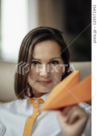 leader steering the team towards innovative solutions, ambition and forward-thinking leadership with a paper airplane leader steering the team towards innovative solutions, ambition and forward-thinking leadership with a paper airplane 120571942