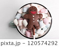 Chocolate man on marshmallow cup, sweet Christmas cookies, close-up, top view 120574292