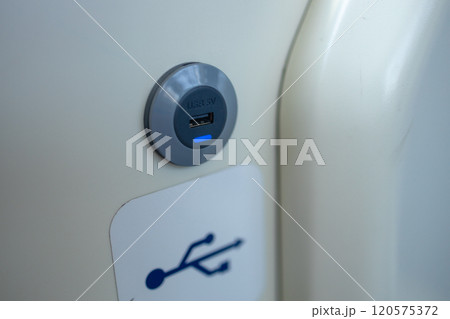 USB sockets in a tram car. USB port in a passenger carriage in Europe for charging gadgets and electronics USB sockets in a tram car. USB port in a passenger carriage in Europe for charging gadgets and electronics 120575372