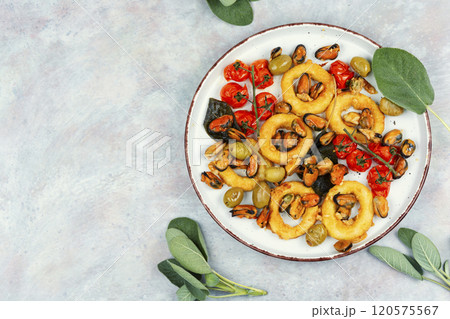 Steamed mussels and roasted squid rings. Steamed mussels and roasted squid rings. 120575567
