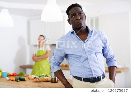 Portrait of man having quarrel with his wife in kitchen 120575937
