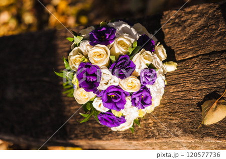 Beautiful wedding bouquet with purple flowers.a bouquet of roses and friezes Beautiful wedding bouquet with purple flowers.a bouquet of roses and friezes 120577736
