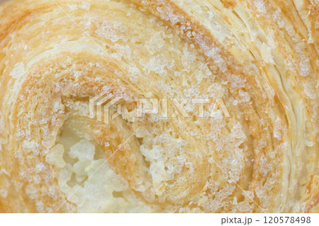 Puff pastry swirls with sugar. 120578498