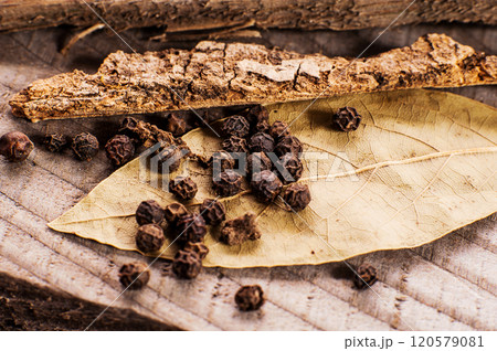 Grains of black pepper as a background close-up. 120579081