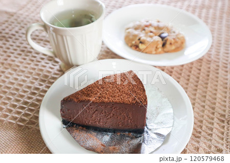 chocolate cake , hot tea and cookie chocolate cake , hot tea and cookie 120579468
