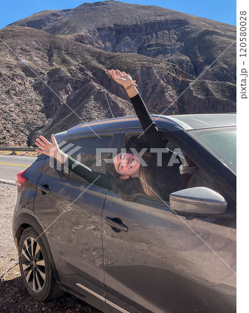 Teenager experiencing a moment of relaxation and enjoyment on holiday. 120580028