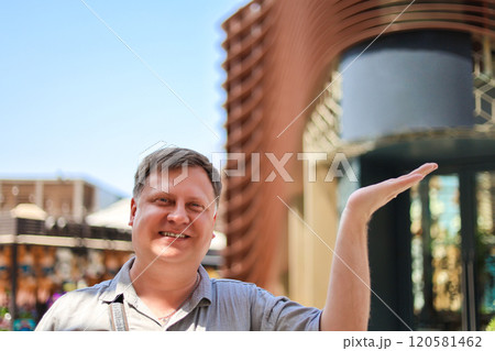 Adult man with hand raised for copy space 120581462