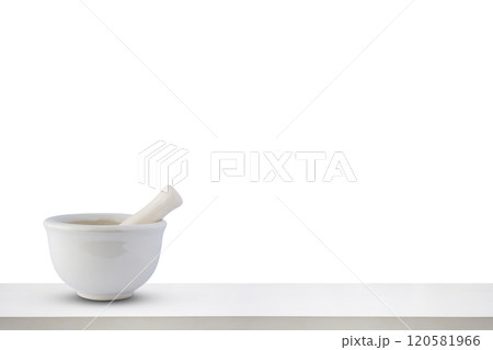 Mortar and pestle on white wooden table top isolated on white background pharmacy concept Mortar and pestle on white wooden table top isolated on white background pharmacy concept 120581966