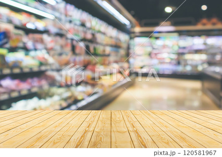 Empty wood table top with supermarket blurred background for product display Empty wood table top with supermarket blurred background for product display 120581967