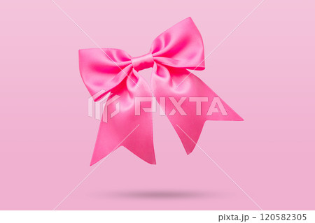 pink gift bow isolated on pink background 120582305