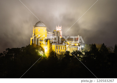 Illuminated Pena Palace in Sintra at Night. Portugal. Clouds, Fog 120583267