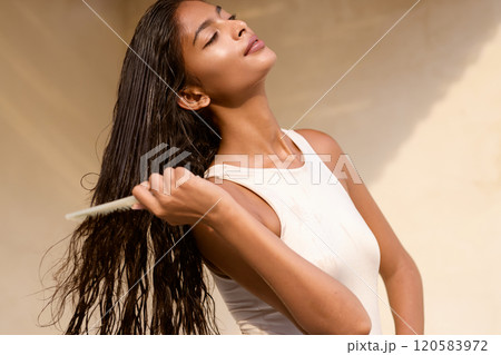 Woman Hair Care. Female Enjoying Sunlight and Relaxing Outdoors Woman Hair Care. Female Enjoying Sunlight and Relaxing Outdoors 120583972