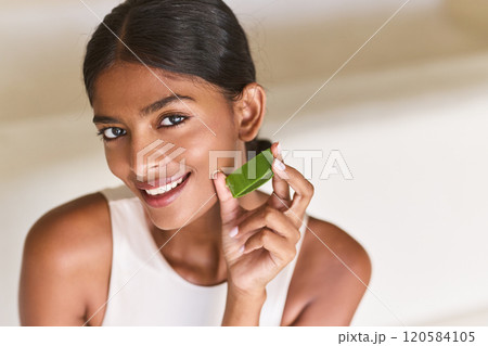 Natural Beauty. Woman Holding Aloe Vera Leaf for Natural Skin Care Natural Beauty. Woman Holding Aloe Vera Leaf for Natural Skin Care 120584105