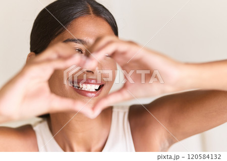 Happy Woman Showing Heart Gesture With Hands And Bright Smile Happy Woman Showing Heart Gesture With Hands And Bright Smile 120584132