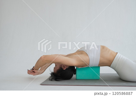 Yoga fitness workout training. Woman practicing yoga isolated on white background. Woman doing sports exercise on yoga mat. Girl in sportswear have training workout for weight loss. Sport and fitness 120586887
