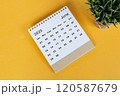 June 2025 desk calendar on yellow background. Directly above. Flat lay 120587679